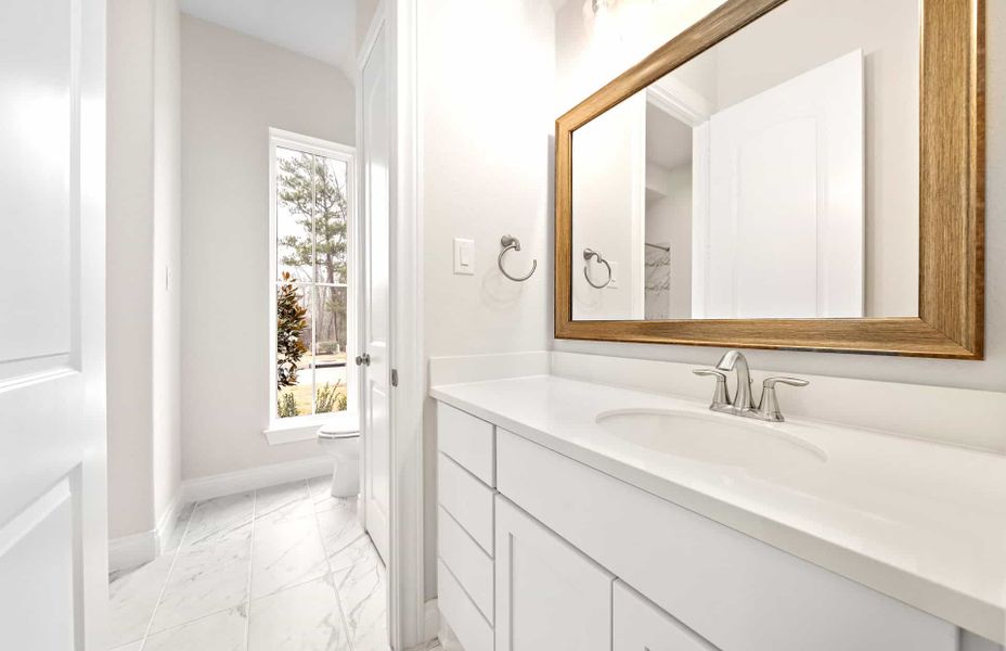 Representative furnished interior of a home built from the 3068 by Ravenna Homes in The Woodlands Hills 65′, Willis (Image 18).