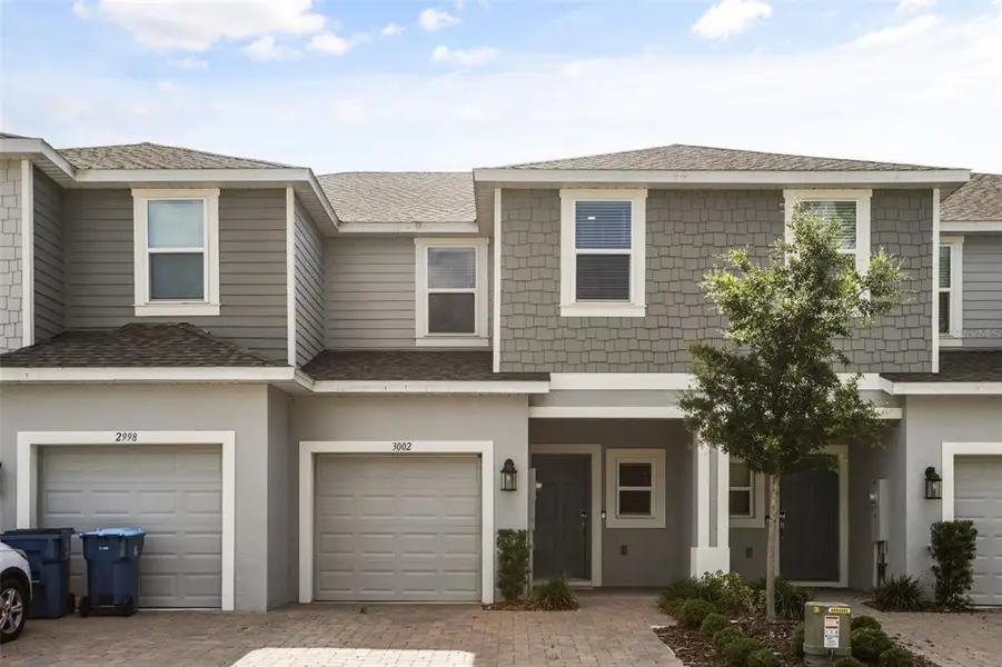 Front exterior of a new home in , Davenport, FL, highlighting curb appeal (Image 25).