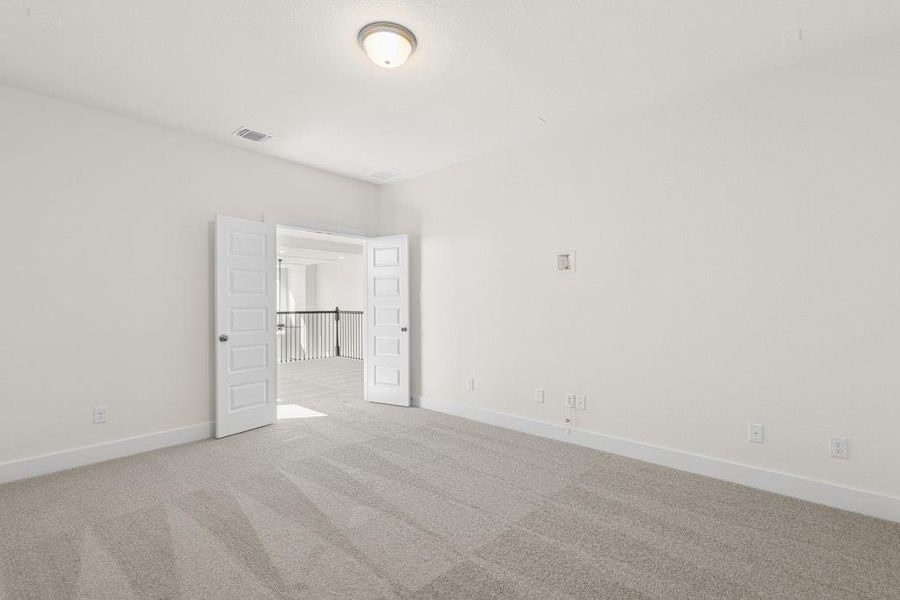 Unfurnished bedroom with light carpet and baseboards Unfurnished bedroom with light carpet and baseboards