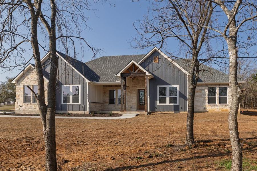 Front exterior of a new home in , Cleburne, TX, highlighting curb appeal (Image 21).