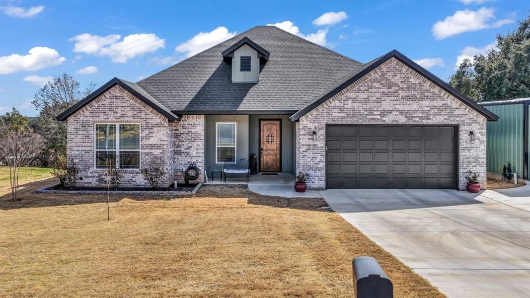 Front exterior of a new home in , Granbury, TX, highlighting curb appeal (Image 23).