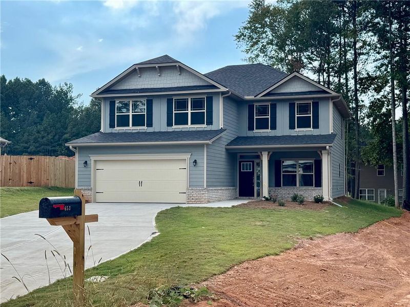 Front exterior of a new home in Magnolia Villas, Cornelia, GA, highlighting curb appeal (Image 14).