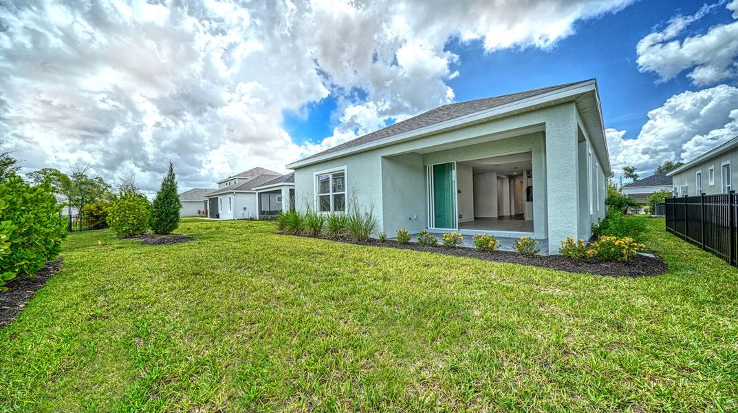 Exterior details and patio area of a home in Wildleaf at North River Ranch, Parrish (Image 21).