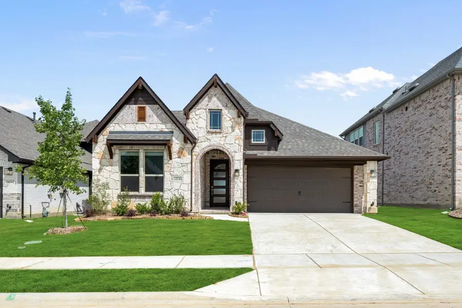 Stone and wood exterior home with arched entry, single-car garage, and manicured front lawn Stone and wood exterior home with arched entry, single-car garage, and manicured front lawn