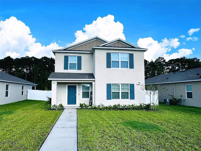 Front exterior of a new home in , Harmony, FL, highlighting curb appeal (Image 21).