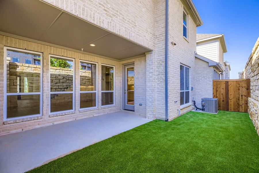 Exterior details and patio area of a home in Castle Hills Northpointe - Townhomes, Carrollton (Image 19). Exterior details and patio area of a home in Castle Hills Northpointe - Townhomes, Carrollton (Image 19).
