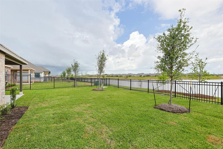 Exterior details and patio area of a home in Sunterra, Katy (Image 2). Exterior details and patio area of a home in Sunterra, Katy (Image 2).