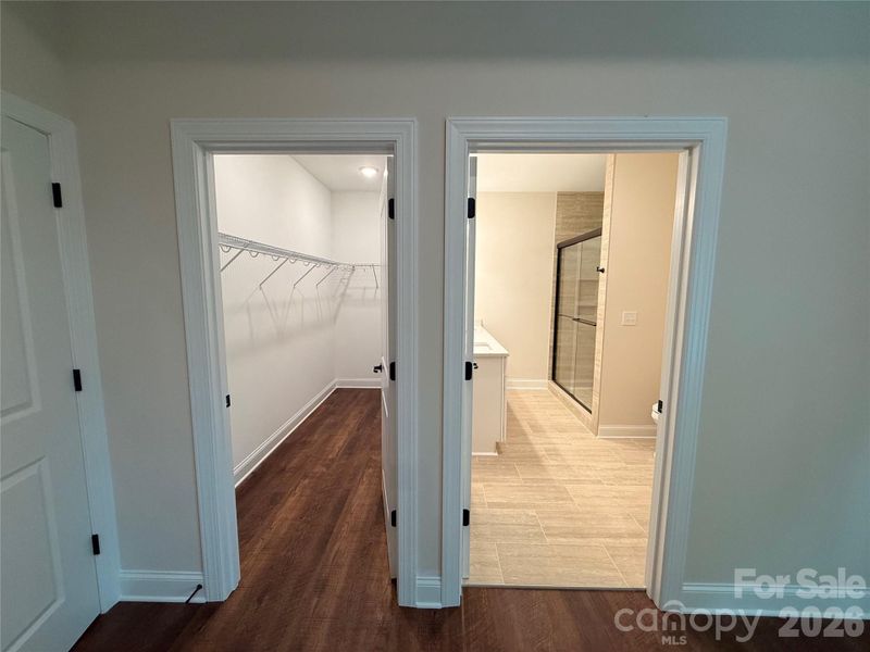 Doors to the closet and ensuite bath in the primary