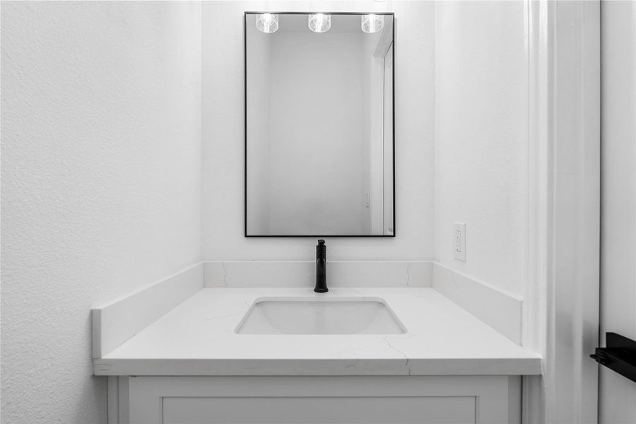 Fresh and modern, a convenient half bath on the main level.