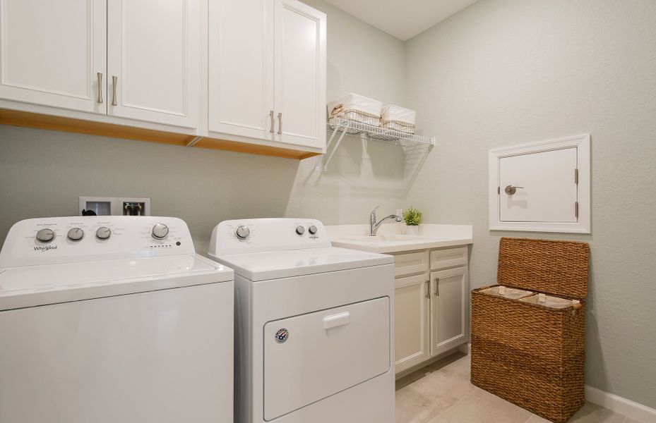 Laundry room with built-in cabinetry