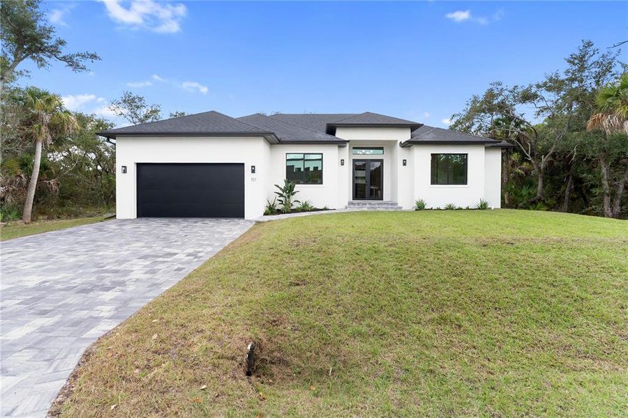 Front exterior of a new home in , Port Charlotte, FL, highlighting curb appeal (Image 30).