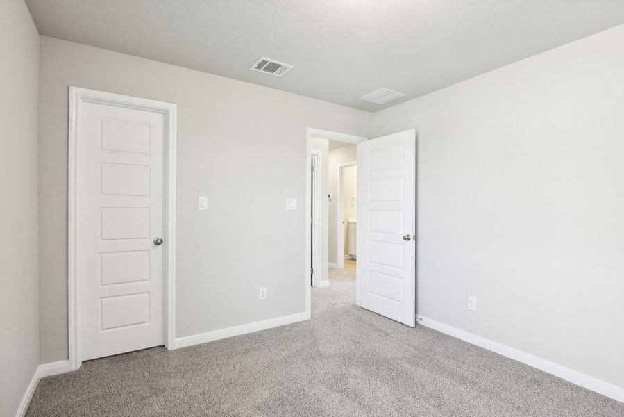 Guest bedroom in the Medina floorplan at a Meritage Homes community.