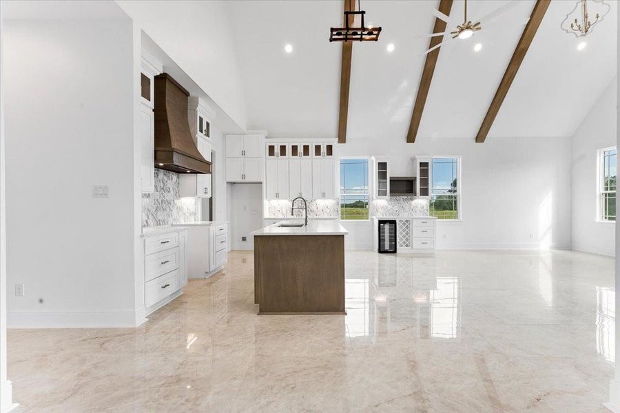 View from the living area toward the kitchen highlighting the home's functional floor plan. View from the living area toward the kitchen highlighting the home's functional floor plan.