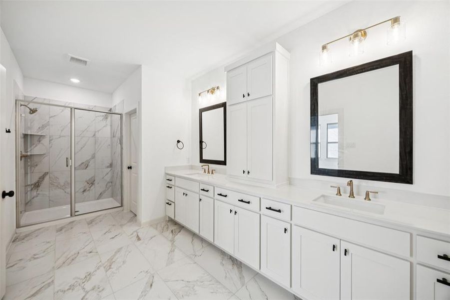 The thoughtful design of this owner's bath offers wonderful storage and plenty of room for two!