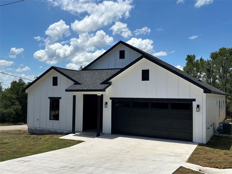 Front exterior of a new home in , Bastrop, TX, highlighting curb appeal (Image 22). Front exterior of a new home in , Bastrop, TX, highlighting curb appeal (Image 22).