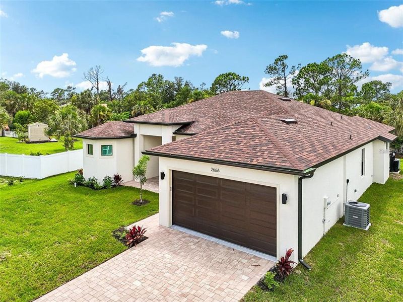 Front exterior of a new home in , North Port, FL, highlighting curb appeal (Image 22). Front exterior of a new home in , North Port, FL, highlighting curb appeal (Image 22).