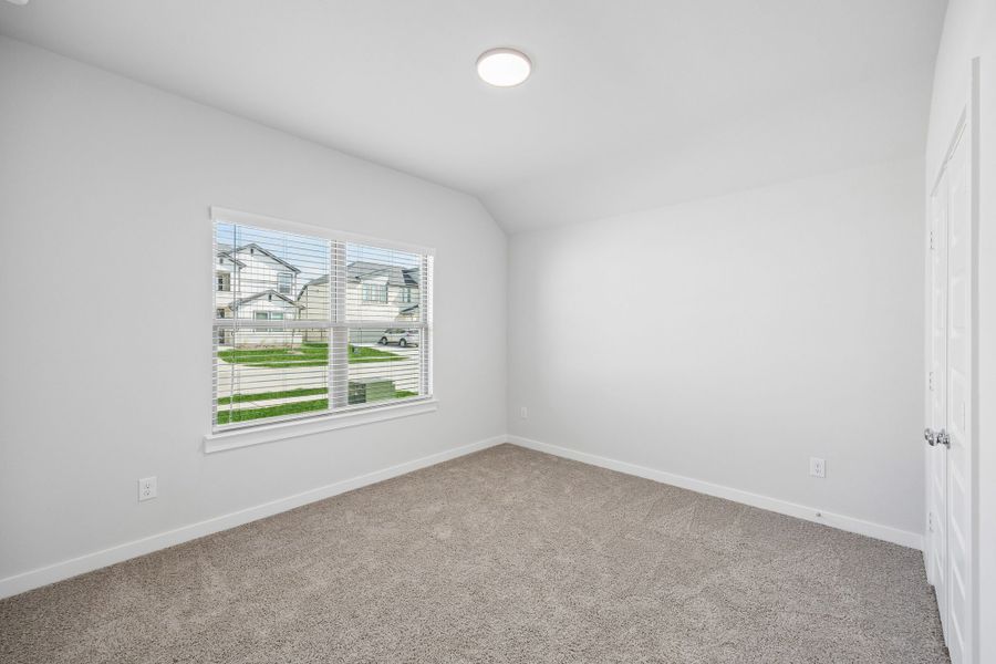 Bedroom in the Oscar home plan by Trophy Signature Homes – REPRESENTATIVE PHOTO