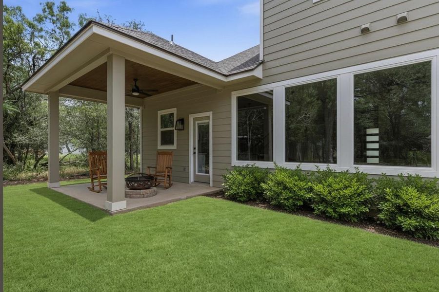 A private covered patio with a fire pit offers a peaceful outdoor retreat.
