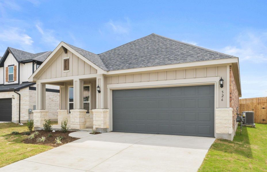 Front exterior of a new home in Sunfield, Buda, TX, highlighting curb appeal (Image 2). Front exterior of a new home in Sunfield, Buda, TX, highlighting curb appeal (Image 2).