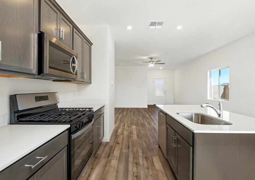The kitchen overlooks the spacious living area.