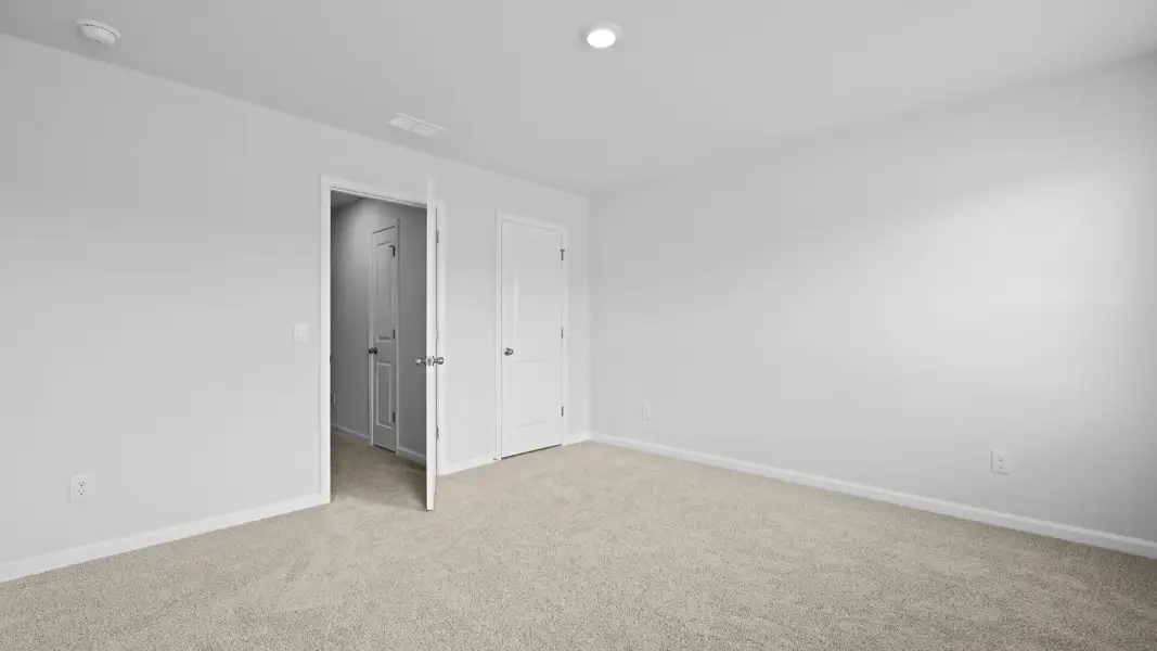 Spacious, unfurnished interior of a new home in Pine Hills Townhomes at Cane Bay, Summerville (Image 30). Spacious, unfurnished interior of a new home in Pine Hills Townhomes at Cane Bay, Summerville (Image 30).