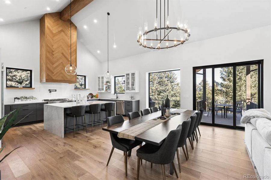 Dedicated dining area with soaring vaulted ceilings provides direct outdoor access and abundant natural light with a multi slide door Dedicated dining area with soaring vaulted ceilings provides direct outdoor access and abundant natural light with a multi slide door