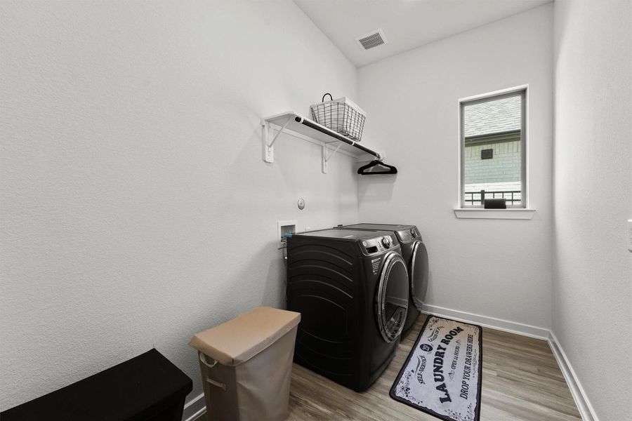 Oversized laundry room with plenty of space for organization. Oversized laundry room with plenty of space for organization.