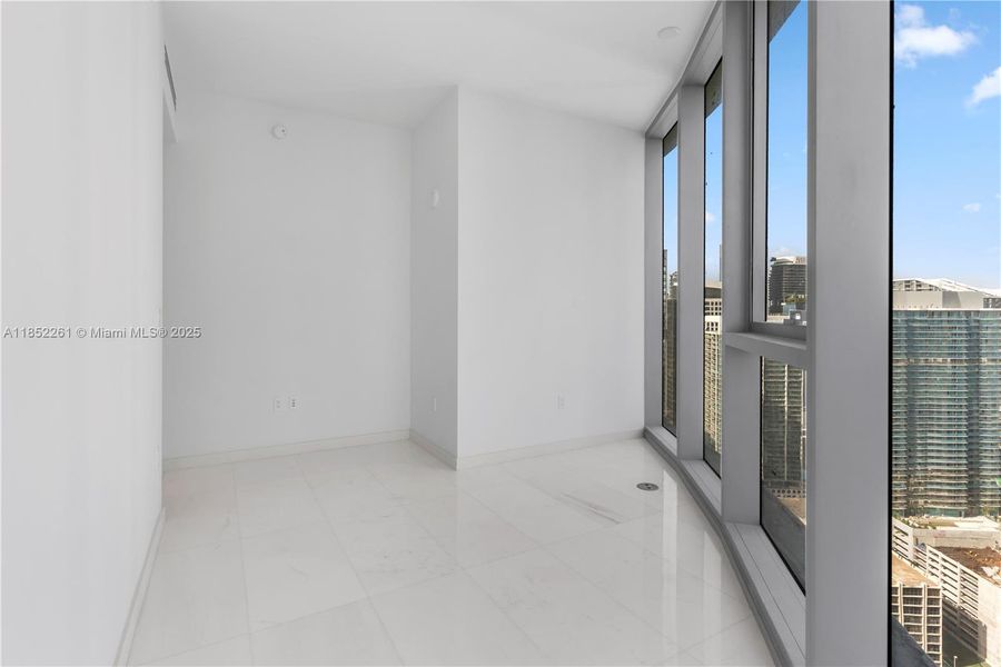 Spacious, unfurnished interior of a new home in Aston Martin Residences, Miami (Image 13).