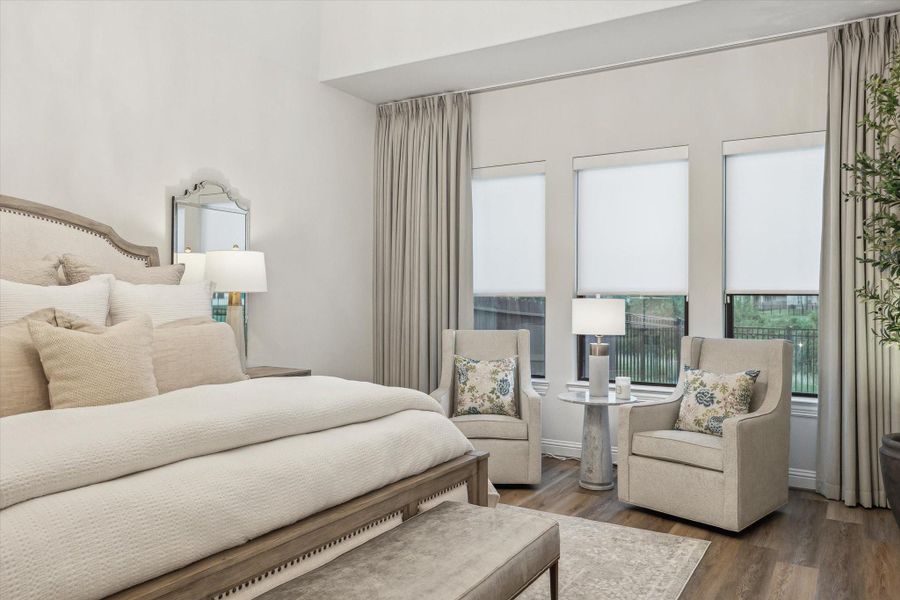 Primary bedroom with extended area for seating Primary bedroom with extended area for seating