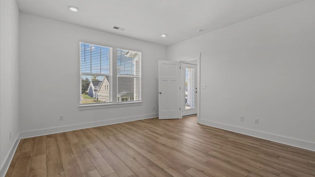 Representative furnished interior of a home built from the Freesia by DRB Homes in Harrier Point, Woodruff (Image 9).