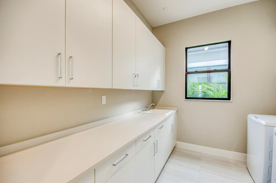 Exterior details and patio area of a home in Apex at Avenir, Palm Beach Gardens (Image 27).