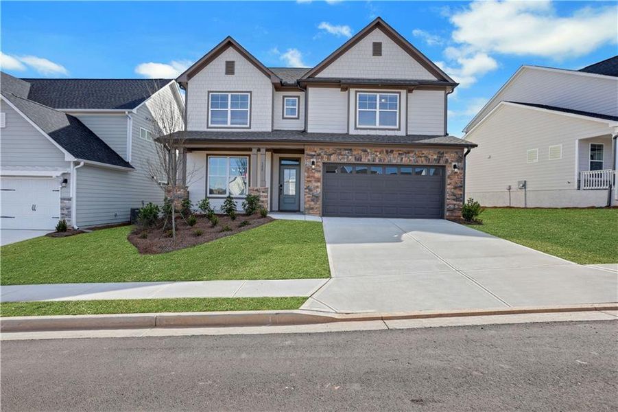 Front exterior of a new home in Twin Lakes, Hoschton, GA, highlighting curb appeal (Image 29).