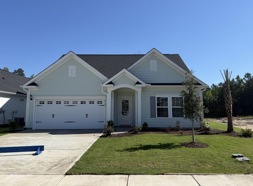 Front exterior of a new home in Grand Park, Leland, NC, highlighting curb appeal (Image 1). Front exterior of a new home in Grand Park, Leland, NC, highlighting curb appeal (Image 1).