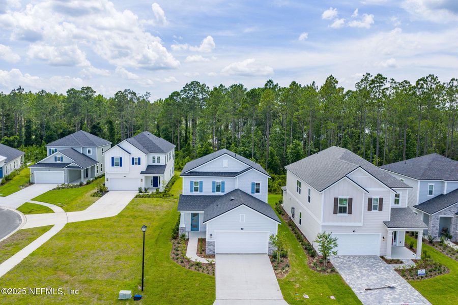 Front exterior of a new home in Beacon Lake, St. Augustine, FL, highlighting curb appeal (Image 31).