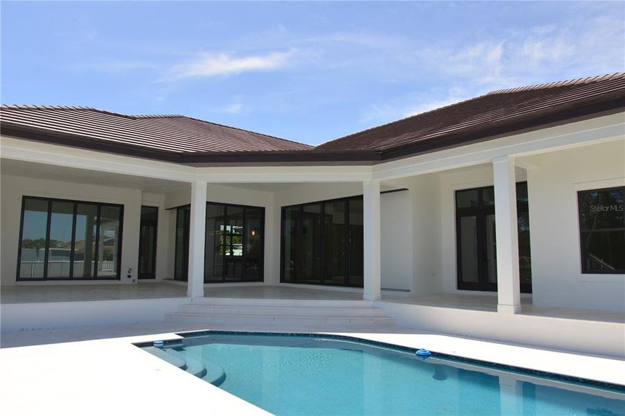Front exterior of a new home in , Sarasota, FL, highlighting curb appeal (Image 16).