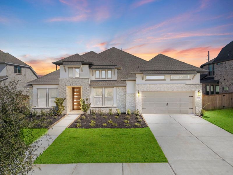 Front exterior of a new home in Valencia 70', Manvel, TX, highlighting curb appeal (Image 2).
