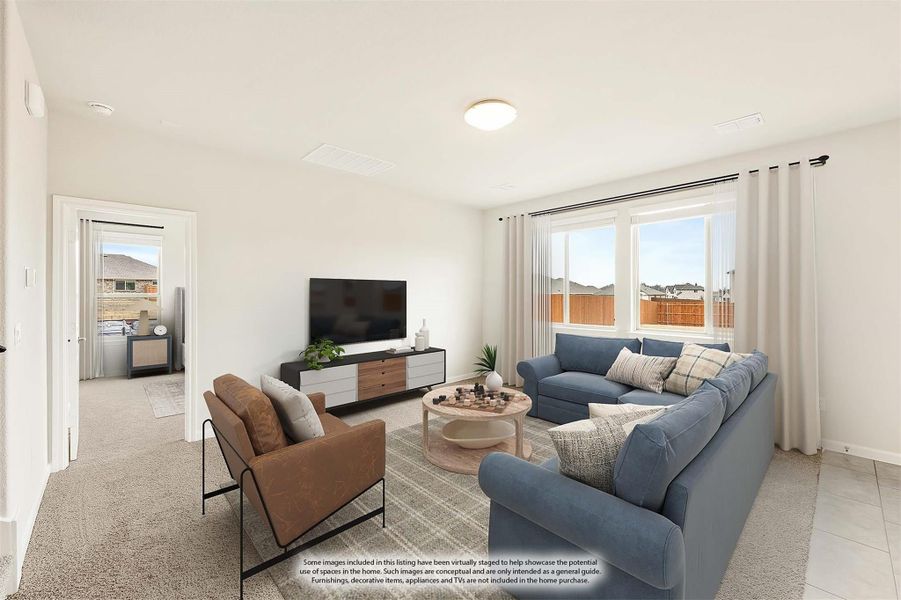 Living room with blue sectional sofa, brown accent chair, TV console, and large window with natural light Living room with blue sectional sofa, brown accent chair, TV console, and large window with natural light