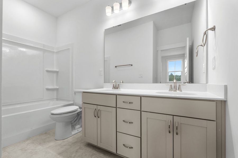 Furnished interior view inside a new home in Long Bay Golf Club, Longs (Image 10).