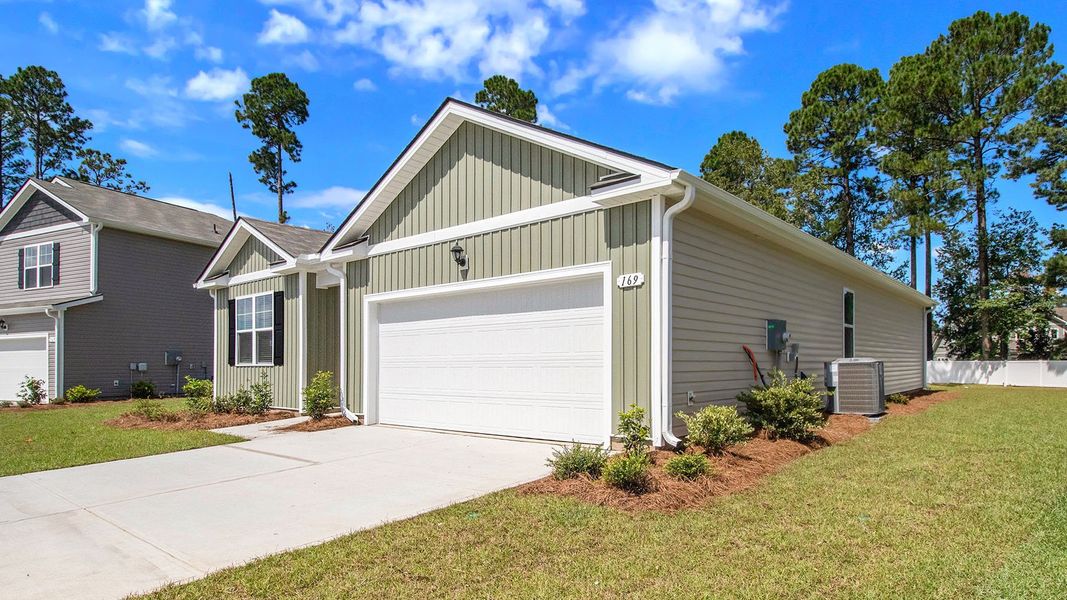 Front exterior of a new home in Sandridge Park, Little River, SC, highlighting curb appeal (Image 20).