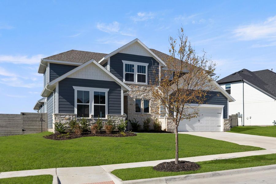 Front exterior of a new home in Inspiration Collection 60 at Painted Tree, McKinney, TX, highlighting curb appeal (Image 2).