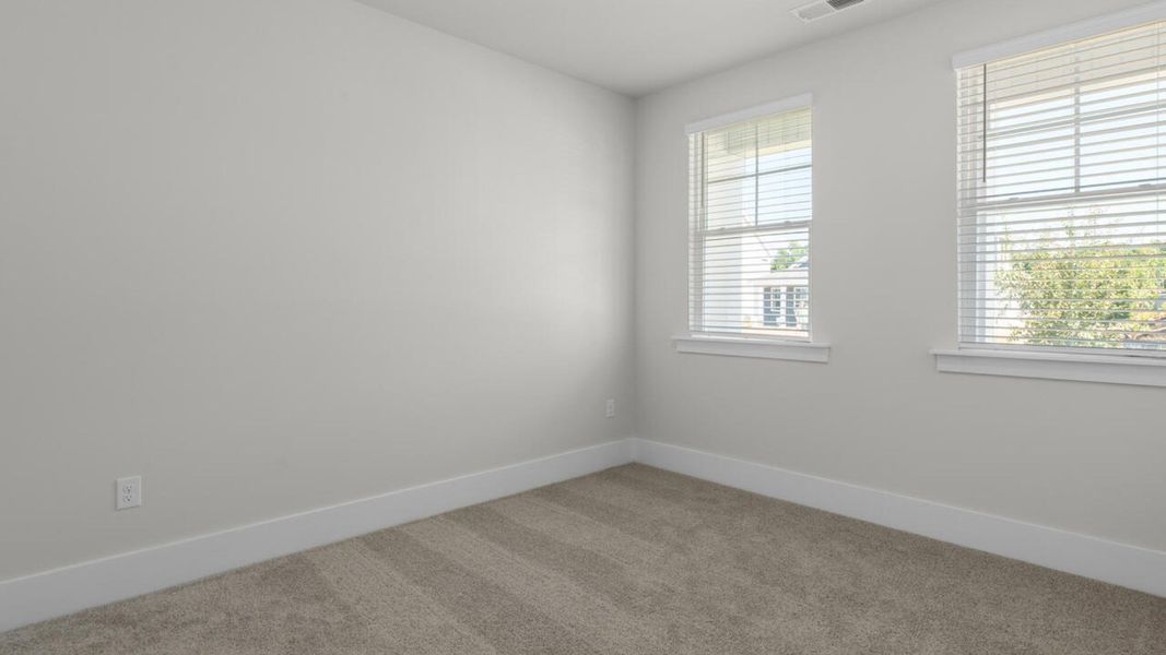 Spacious, unfurnished interior of a new home in Surfside Landing, Hubert (Image 21).