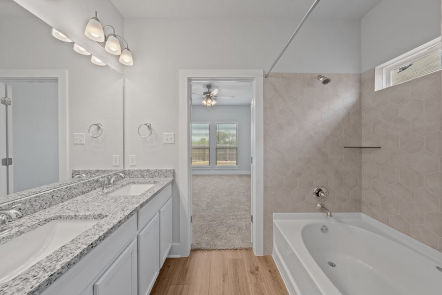 Representative furnished interior of a home built from the Austen by Omega Builders in North Point, Temple (Image 10).