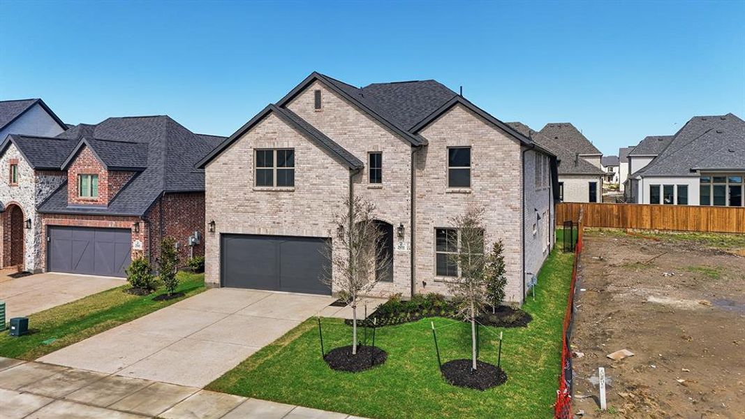 Front exterior of a new home in Brookhollow West, Prosper, TX, highlighting curb appeal (Image 26). Front exterior of a new home in Brookhollow West, Prosper, TX, highlighting curb appeal (Image 26).