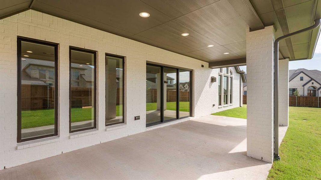 Exterior details and patio area of a home in North Sky 55', Celina (Image 3).