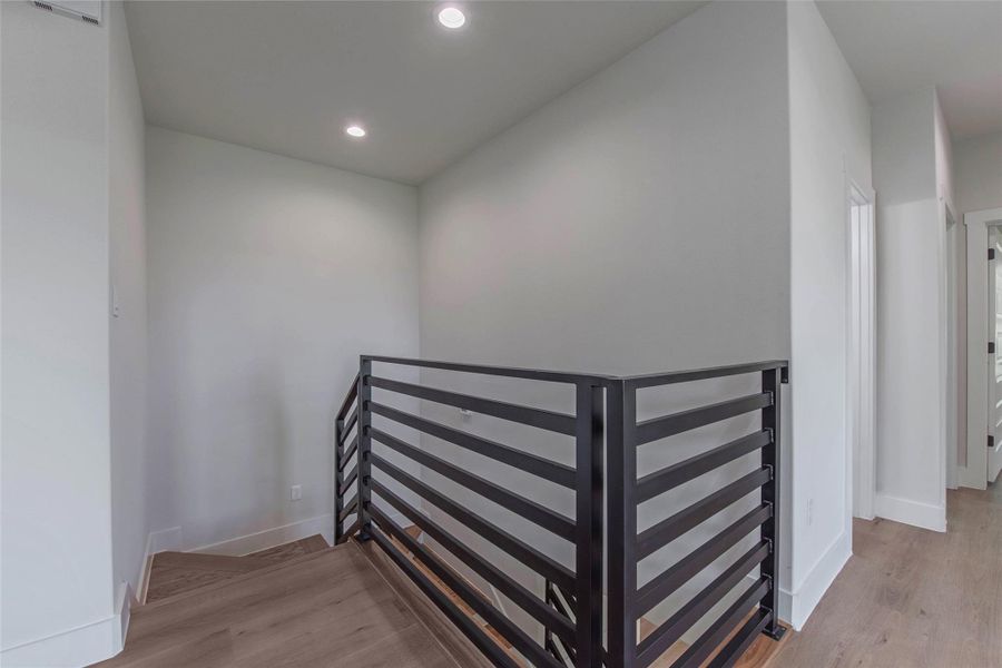 The staircase has a light, airy design that enhances the home’s modern flow and openness. The staircase has a light, airy design that enhances the home’s modern flow and openness.