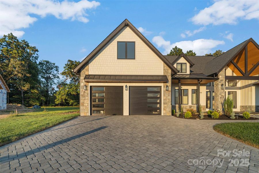 Front exterior of a new home in , Fletcher, NC, highlighting curb appeal (Image 1). Front exterior of a new home in , Fletcher, NC, highlighting curb appeal (Image 1).