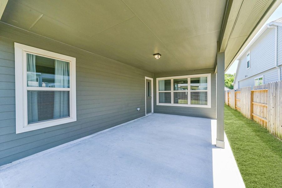 Even with the patio covering, the abundance of windows brings plenty of natural light indoors. Set up your grill and entertain with ease in this bright outdoor space. Even with the patio covering, the abundance of windows brings plenty of natural light indoors. Set up your grill and entertain with ease in this bright outdoor space.