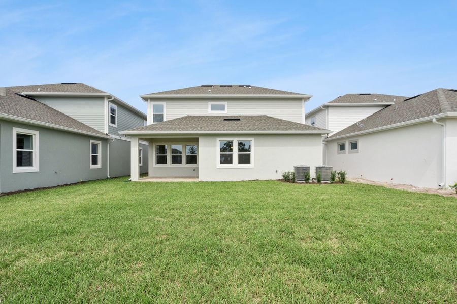 Exterior details and patio area of a home in Northlake at Ovation, Winter Garden (Image 21).