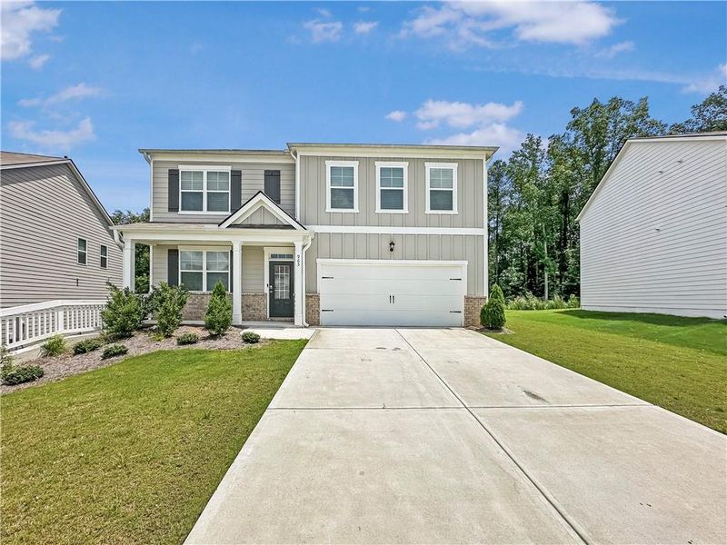 Front exterior of a new home in Oakhurst Glen, Fairburn, GA, highlighting curb appeal (Image 18).