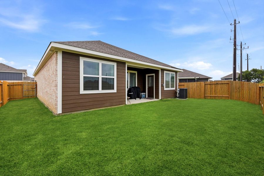 Exterior details and patio area of a home in Vacek Country Meadows, Richmond (Image 28).
